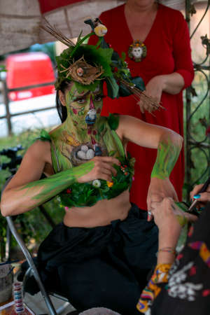 Montefiorino Modena, Italy: 2015 05 01 queen's day public event face painting portrait on model brunette gnomes and elves. High quality photoのeditorial素材