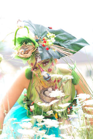 Montefiorino Modena, Italy: 2015 05 01 queen's day public event face painting portrait on model brunette gnomes and elves. High quality photoのeditorial素材