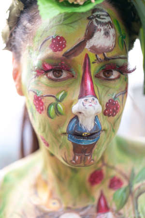 Montefiorino Modena, Italy: 2015 05 01 queen's day public event face painting portrait on model brunette gnomes and elves. High quality photoのeditorial素材