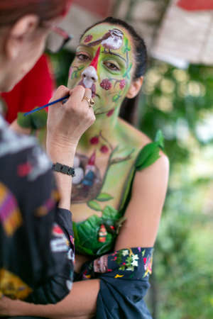 Montefiorino Modena, Italy: 2015 05 01 queen's day public event face painting portrait on model brunette gnomes and elves. High quality photoのeditorial素材