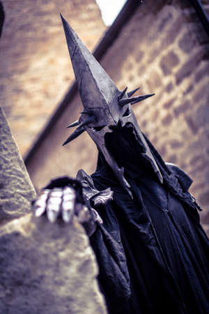 Lucca, Italy - 2018 10 31: Lucca Comics free cosplay event around city Nazgul warrior with helmet and sword from the lord of the rings. High quality photoのeditorial素材