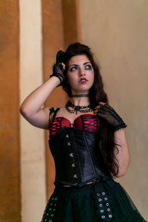 beautiful brunette girl with dark gothic steam punk dress and makeup. High quality photo
