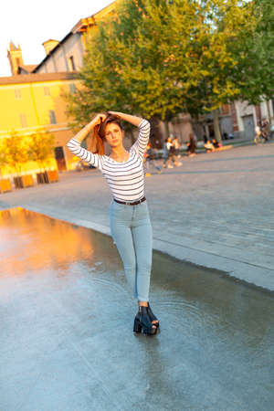 beautiful Italian girl poses in the center of Reggio Emilia. High quality photoの写真素材