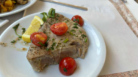 grilled tuna fillet with tomatoes. High quality photoの写真素材