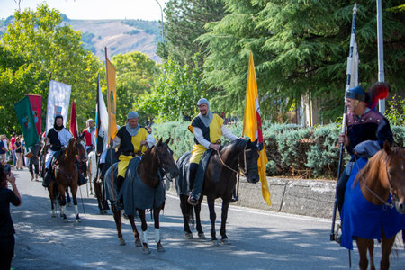 Canossa, Reggio Emilia - Italy: 2019 01 07 Medieval historical re-enactment of Martilde di Canossa with flag-wavers and extras in themed dresses. High quality photoのeditorial素材