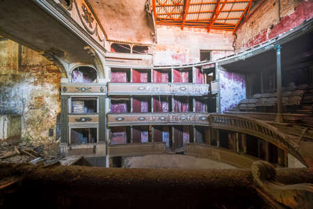 interior stage and armchairs of old decadent abandoned theater in Italy. High quality photoの写真素材