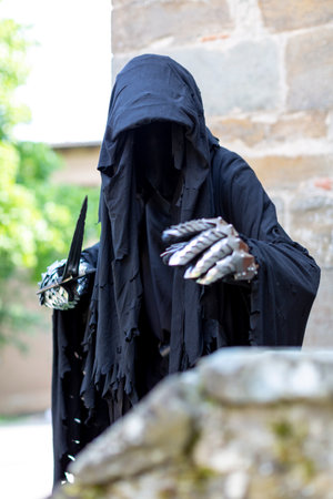 Lucca, Italy - 2018 10 31: Lucca Comics free cosplay event around city Nazgul warrior with helmet and sword from the lord of the rings. High quality photoのeditorial素材