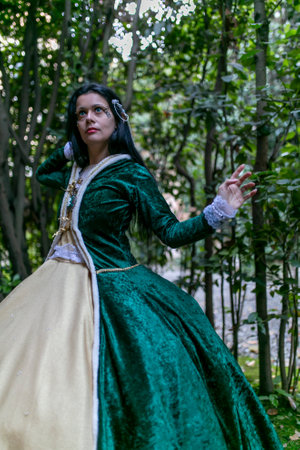 Lucca, Italy - 2018 10 31 : Lucca Comics free cosplay event around city dark vampire girl in green dress in bamboo thicket. High-quality photoのeditorial素材