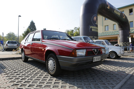 Bibbiano-Reggio Emilia Italy - 07 15 2015: Free rally of vintage cars in the town square Alfa Romeo 75. High quality photoのeditorial素材