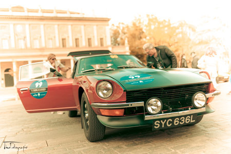 Reggio Emilia, Italy: 2019 05 04 free rally of classic vintage stories cars in downtown datsun....