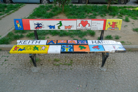Turin, Italy - 2022 06 04: piazza Moncenisio Mau bench decorated with style of famous artists Keith Haring. High quality photoのeditorial素材