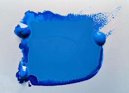 Close up of blue paint shapes on white background with copy space. High-quality photoの写真素材