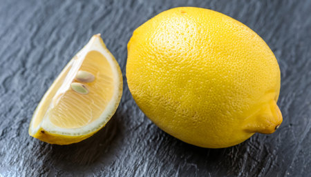 whole natural lemon and wedges. High-quality photoの写真素材