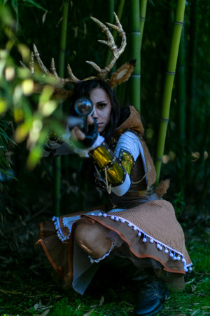 Lucca, Italy - 2018 10 31 : Lucca Comics free cosplay event around city girl with deer antlers and rifle. High-quality photoのeditorial素材
