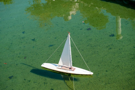 playing boat in water. High-quality photoの写真素材