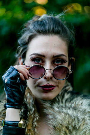 beautiful girl dressed dark steampunk portrait with sunglasses.High quality photoのeditorial素材