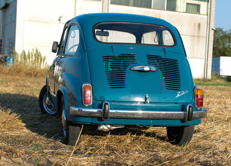 Reggio Emilia Italy : 2023 01 08 example of Vintage old car Fiat 750 in sugar paper blue color on a sunny day. High quality photoのeditorial素材