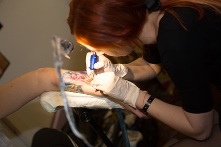 Milano Italy: 2014 01 10 Milano Tattoo Convention, a free event about tattoo and ink culture girl tattoos arm. High quality photoのeditorial素材