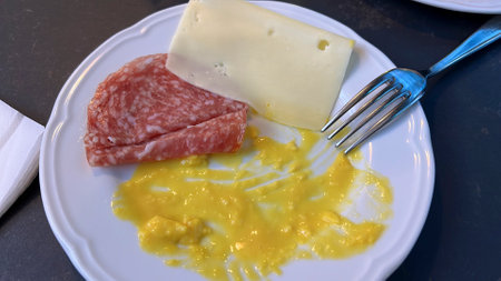 continental breakfast with salami, scrambled eggs and cheese. High quality photoの写真素材