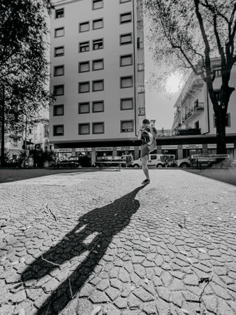 young boxer street fighter trains in the square between the buildings. High quality photoの写真素材