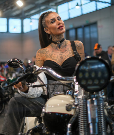 Verona, Italy - 2018 01 12 : MBE Verona Bike Expo Bike and Custom car exibituon - Beaufiful brunette girl on a bike. High quality photoのeditorial素材