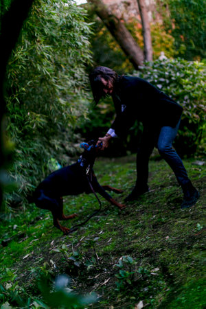 Lucca, Italy - 2018 10 31 : Lucca Comics free cosplay event around city boy with doberman dog. High quality photoのeditorial素材