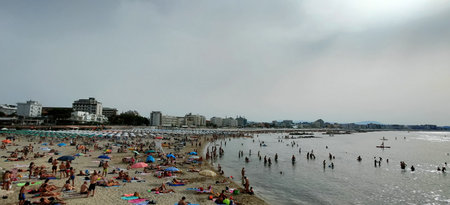 Rimini,Italy: 08 08 2023 Rimini beach with bathers and umbrellas. High quality photoのeditorial素材