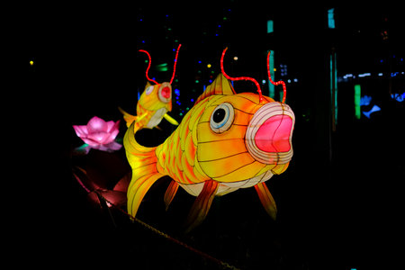 This is a charming lantern designed in the unique shape of a fish, featuring an adorable pink nose that adds to its whimsical appealの写真素材
