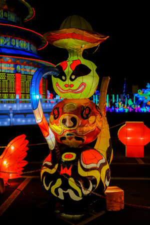 A beautiful display of lanterns, prominently featuring one that has the word written on it in bright charactersの写真素材