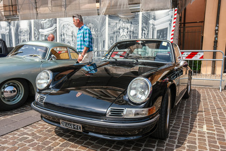 Ferrara Italy - 06 08 2024 : Free rally of vintage cars in the town square Porsche 911 Serie G. High...