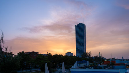 Cesenatico skyscraper seen from the beach at sunset sunrise. High quality photoの写真素材
