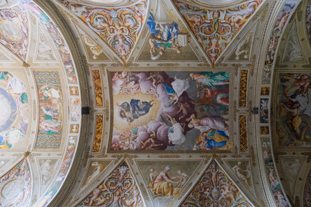 A close-up of a fresco on an ornate ceiling in a historic building, displaying the artistry and detail of the artwork.の写真素材
