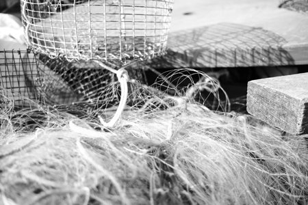 A close-up shot of a fishing net with colorful buoys, showing the tools of the trade for fishermen.の写真素材