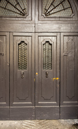 A close-up shot of an ornate wooden door, showcasing its intricate details and craftsmanship.