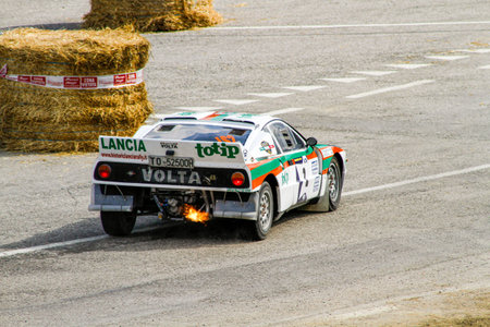 San Marino: 2010 09 01 Rally free eventDramatic rear view of a white, green, and red liveried Lancia...