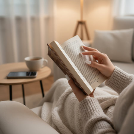 Woman Relaxing at Home Reading a Book Quietlyの素材
