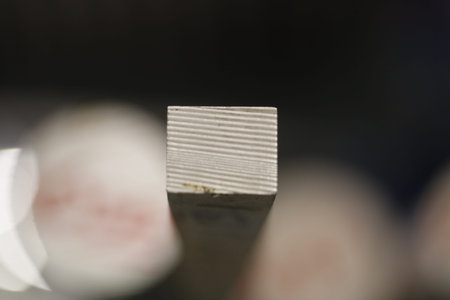 Macro Textured Metal Block With Ridges, Shallow Depth Of Field Highlighting Horizontal Grooves And...
