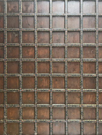 The image shows a detailed view of a wall featuring squares. The squares resemble bricks or wood...