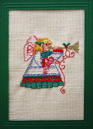 Cross stitch Christmas Card showing an angelの写真素材