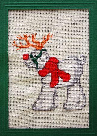 Cross stitch Christmas Card showing a red nose reindeerの写真素材
