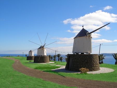 three Windmills with the ecean in the backgroundの写真素材