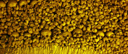 Lots of stacked human bones and skulls
