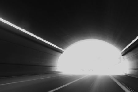 High speed tunnel. Exiting a tunnel at high speed.の写真素材