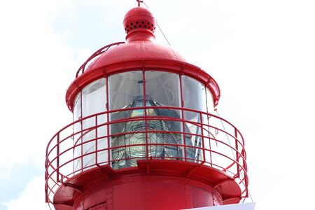 top detail of a red lighthouseの写真素材