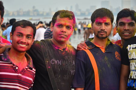 Mumbai, India - September 2013 - Young men with smeared colors on faces during the Hindu Festival  of Ganeshaのeditorial素材