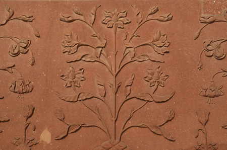 Wall of Taj Mahal, India with intricate designs and patterns in red sand stone with inlaid marbleのeditorial素材