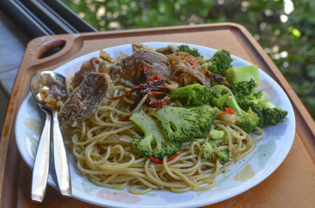 Spaghetti with beef shank and broccoliの写真素材