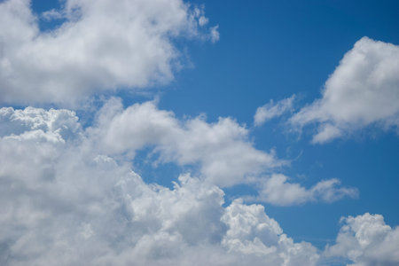 Blue sky background with tiny clouds
