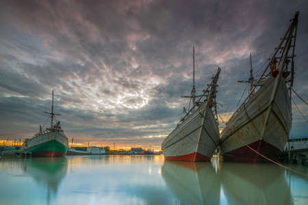 Big cargo ship at Tanjungpandan port at sunriseの写真素材