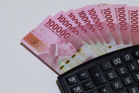 Calculator and money of Indonesia. Rupiah currency. economic concept. top view.